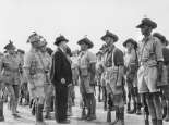 Minister for the Army, the Honorable Frank Forde, greeting Corporal Latham during a visit to the Western Training Centre, Northam, W.A. 2/4/1943. Courtesy Australian War Memorial, http://www.awm.gov.au/collection/051013/