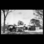 Carrolup. Noongar standing outside of huts at mission. Courtesy State Library of Western Australia, The Battye Library
